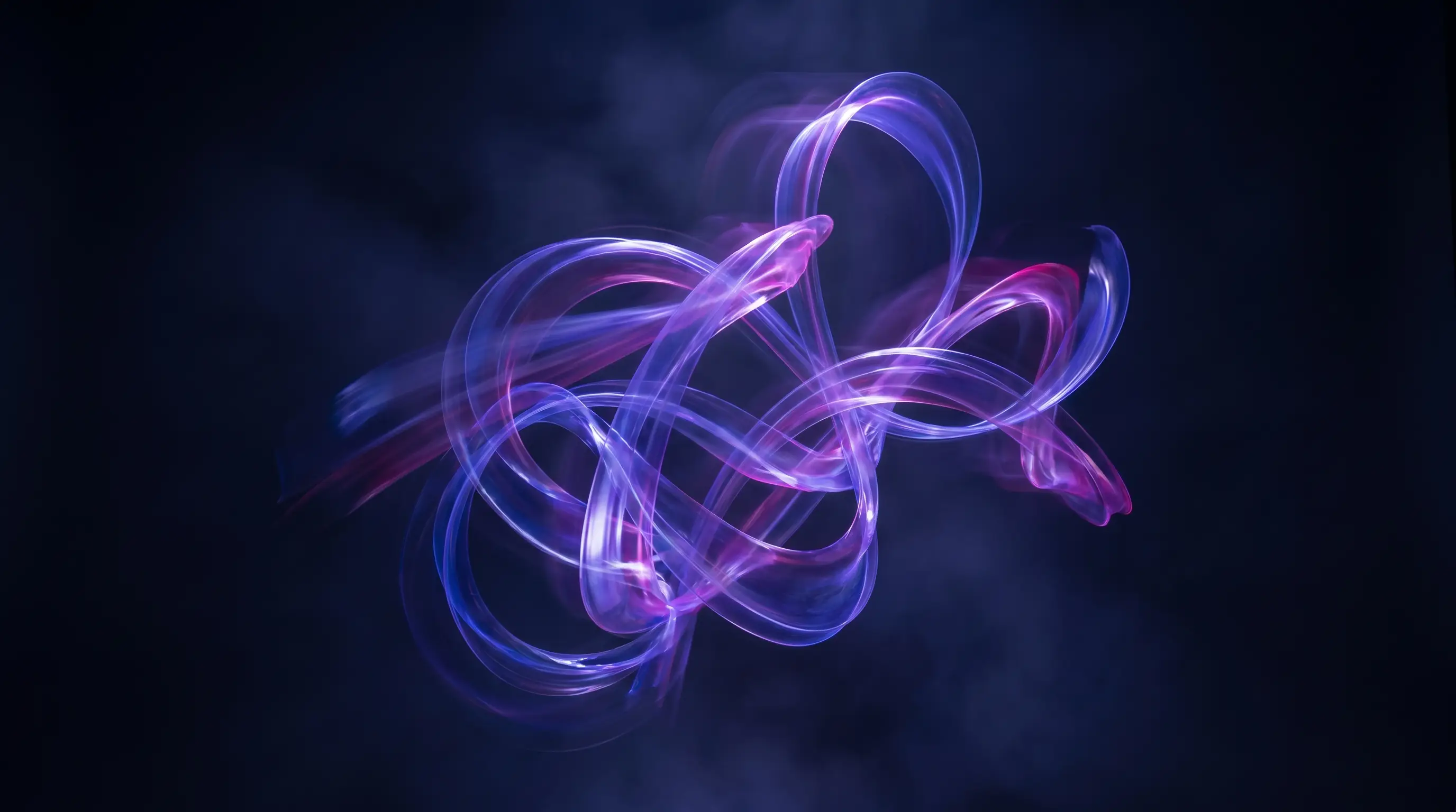 Flowing indigo, violet and magenta light ribbons on a deep navy background — KINETA's signature motion look.